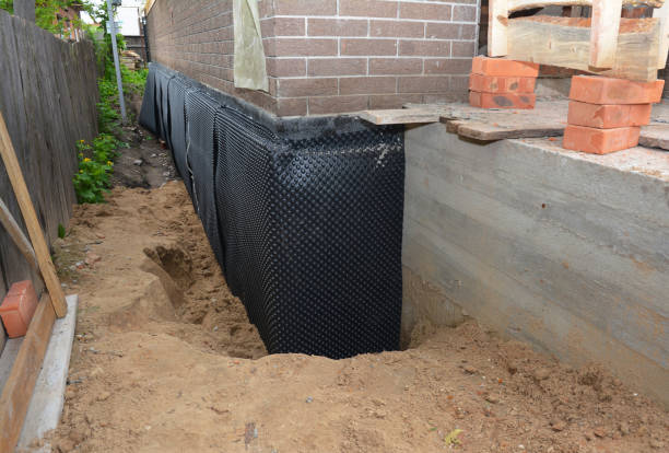 Happy homeowners after waterproofing job in Bushton
